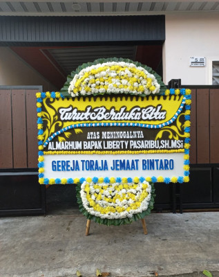 Papan Bunga Duka di Ledeng